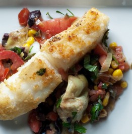 sea-bass-plated-with-tomatoes,-corn,-artichokes,-basil,-parsely-and-leeks