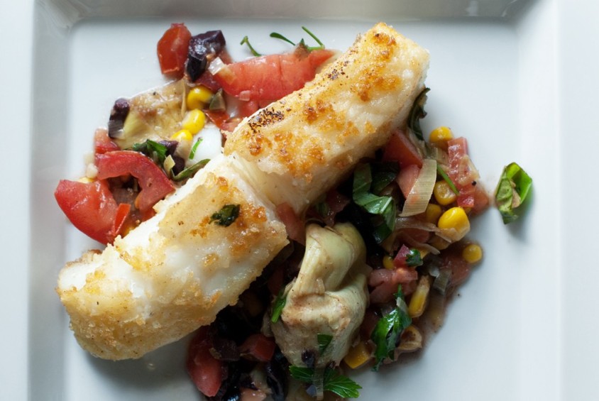 sea-bass-plated-with-tomatoes,-corn,-artichokes,-basil,-parsely-and-leeks