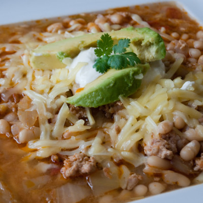 italian-sausage-and-bean-chili-with-cheese-and-avocado