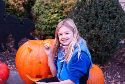 enjoying-a-pumpkin-biscuit-while-carving-the-pumpkin