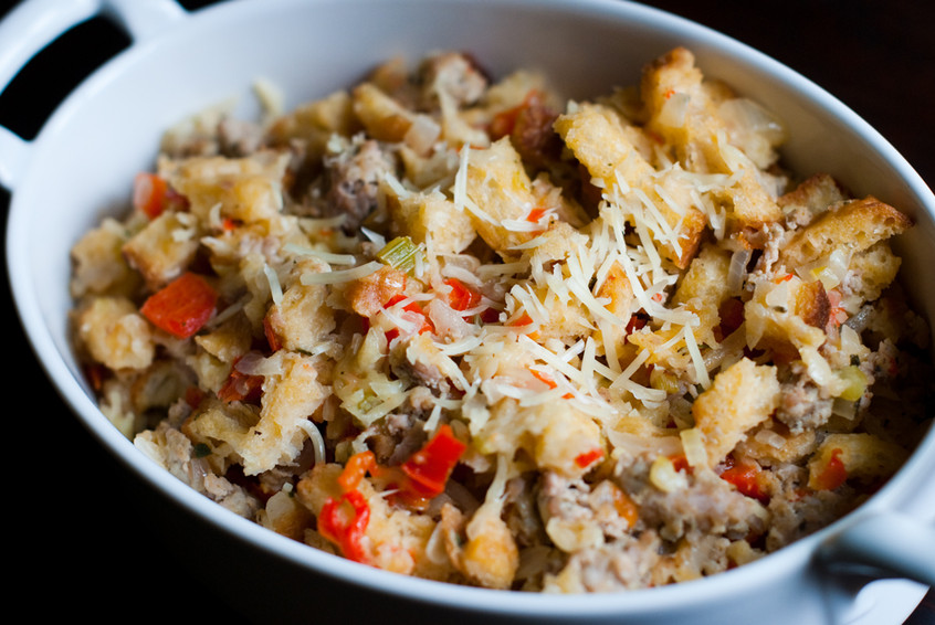 italian-stuffing-with-sausage-and-parmesan-cheese-plated-in-buttered-casserole-dish