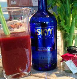 spicy-bloody-marys-in-a-pitcher-with-skyy-vodka,-celery-and-Margarita-Himalayan-Salt