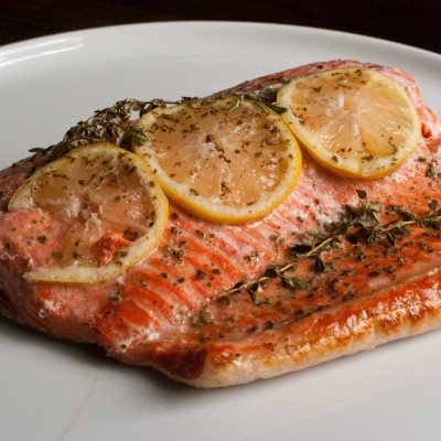 salmon-baked-in-parchment-paper-with-lemon-slices,-thyme-and-oregano-and-sage-french-grey-salt