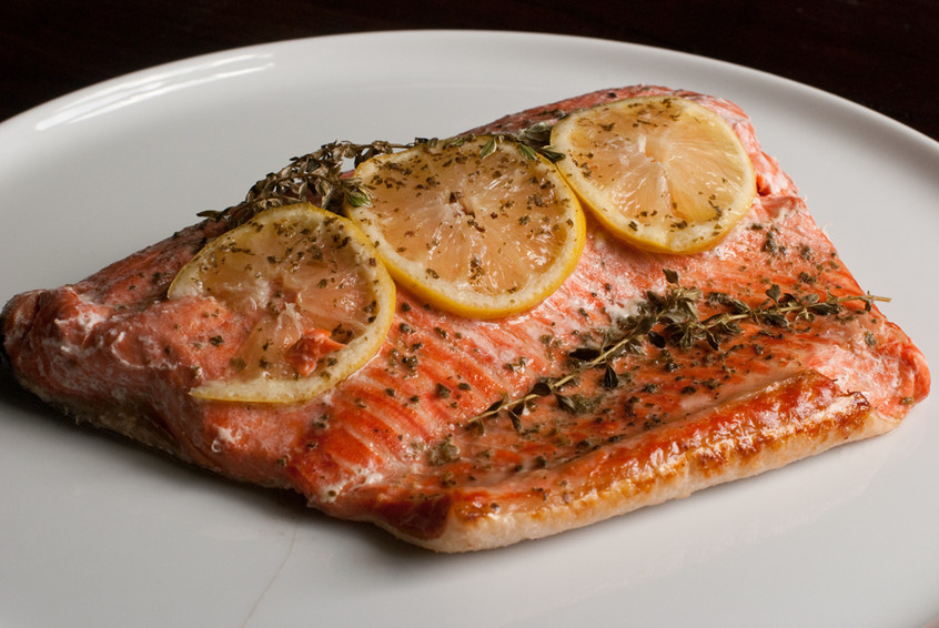 salmon-baked-in-parchment-paper-with-lemon-slices,-thyme-and-oregano-and-sage-french-grey-salt