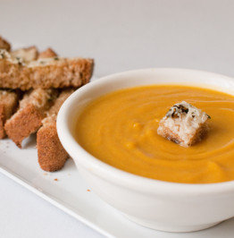a-bowl-of-warm-cumin-squash-soup-with-a-cheesy-sage-crouton