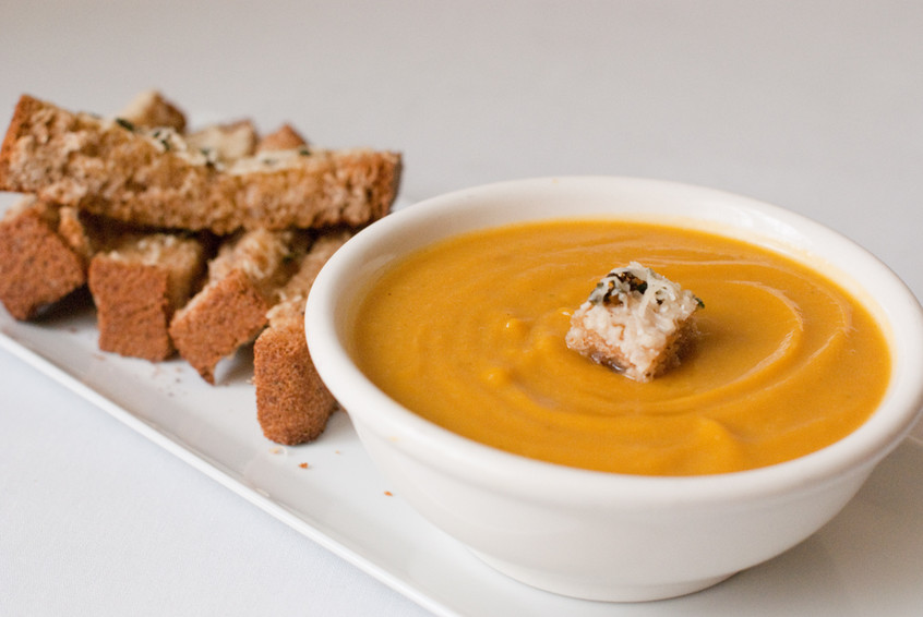 a-bowl-of-warm-cumin-squash-soup-with-a-cheesy-sage-crouton