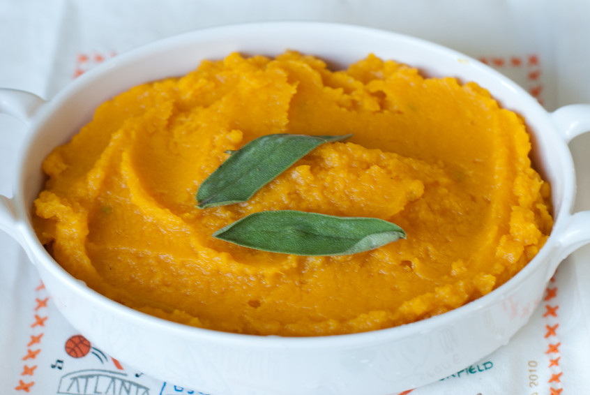 mashed-butternut-squash-with-sage-leaves-in-casserole-dish