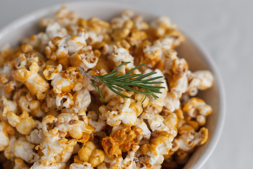 Rosemary-sprig-on-top-of-rosemary-sea-salt-caramel-popcorn